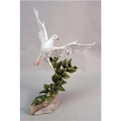 A BOEHM POLYCHROME-DECORATED BONE PORCELAIN FIGURE OF A DOVE