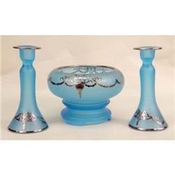 A FROSTED GLASS-AND-SILVER-OVERLAY SERVING BOWL ON STAND WITH TWO MATCHING CANDLESTICKS
