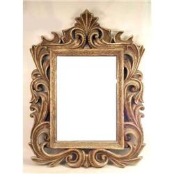 A LARGE GOLD-PAINTED ORNATE COMPOSITION FRAMED MIRROR