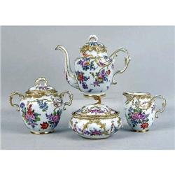 A POLYCHROME-DECORATED PARCEL-GILT PORCELAIN TEA SERVICE