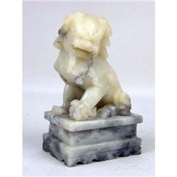 A CARVED HARDSTONE CHINESE LION