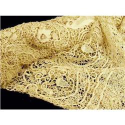 A ROLLED BOLT OF COTTON LACE