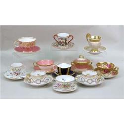 A MISCELLANEOUS GROUP OF POLYCHROME PARCEL-GILT DECORATED PORCELAIN TABLE ARTICLES