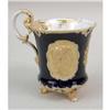 Image 1 : A COBALT PARCEL-GILT DECORATED PORCELAIN FOOTED HANDLED CUP