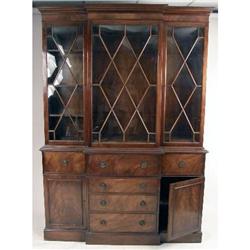 A GEORGE III STYLE FIGURED MAHOGANY BREAKFRONT BOOKCASE