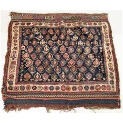 AN ORIENTAL WOOL SADDLE RUG