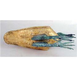 A PATINATED AND GILDED METAL AND COMPOSITION SCULPTURE OF AN IBIS