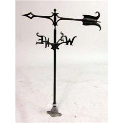 A SMALL DECORATIVE WROUGHT-IRON WEATHERVANE