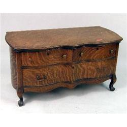 A QUARTERSAWN OAK CHEST OF DRAWERS