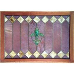 A DIAMOND AND FLEUR-DE-LIS PATTERN STAINED GLASS WINDOW