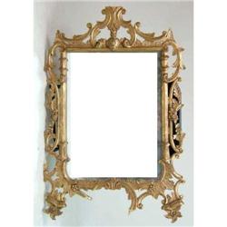A GEORGE II-STYLE CARVED GILTWOOD LOOKING GLASS
