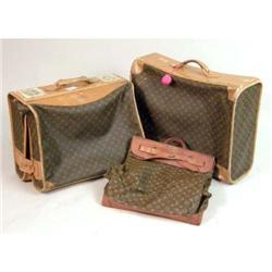 A LARGE LOUIS VUITTON SUITCASE, DRESS CARRIER AND SATCHEL