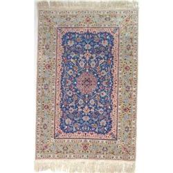 A SMALL SILK PERSIAN RUG