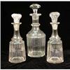 Image 1 : THREE COLORLESS GLASS STOPPERED DECANTERS