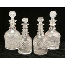 A GROUP OF COLORLESS GLASS STOPPERED DECANTERS
