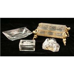 A METAL MOUNTED COLORLESS GLASS COVERED BOX