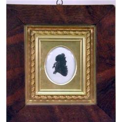 A FRAMED PAINTED SILHOUETTE