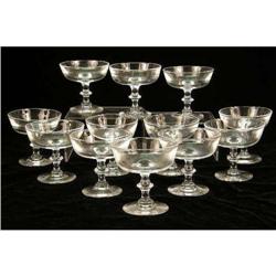A BOXED SET OF COLORLESS GLASS STEUBEN CHAMPAGNE GLASSES