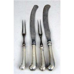 A SET OF TWELVE EARLY PISTOL HANDLED KNIVES AND FORKS