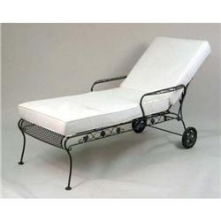 A WROUGHT-IRON GARDEN CHAISE LOUNGE