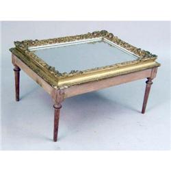 A "MIRROR IN A FRAME"-TOPPED LOW TABLE