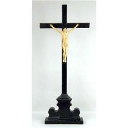A CARVED IVORY CRUCIFIX ON WOODEN CROSS AND BASE