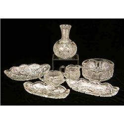 AN ASSORTED GROUP OF CUT COLORLESS GLASS TABLE ARTICLES