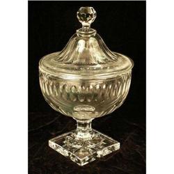 A COLORLESS GLASS FOOTED COVERED COMPOTE