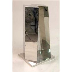 AN ABSTRACT POLISHED MIRRORED STAINLESS STEEL SCULPTURE