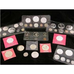 AN ASSORTED GROUP OF FOREIGN PROOF COIN SETS