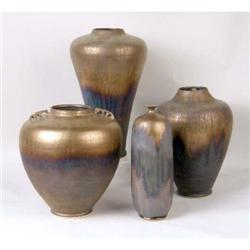 A GROUP OF FOUR EARTHENWARE VASES