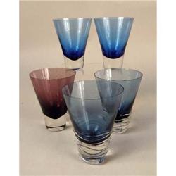 A GROUP OF COLORED GLASS BARWARE