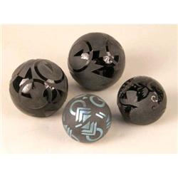 A GROUP OF ONYX AND FROSTED GLASS PAPERWEIGHTS