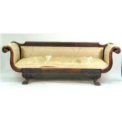 A CLASSICAL CARVED MAHOGANY SOFA