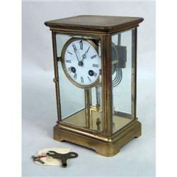 AN ENAMELED CARRIAGE CLOCK