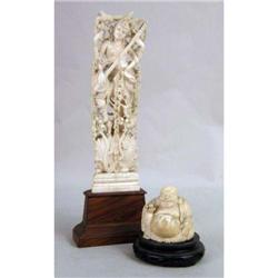 A CARVED BONE SCULPTURE OF A DEITY
