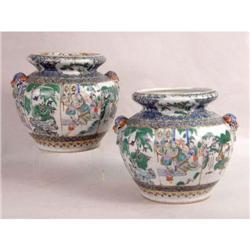 A PAIR OF MATCHING POLYCHROME PARCEL-GILT DECORATED PORCELAIN URNS