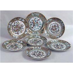 A SET OF SIX POLYCHROME PARCEL-GILT DECORATED PORCELAIN LUNCHEON PLATES