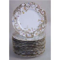 TWELVE LIMOGES POLYCHROME-DECORATED PARCEL-GILT PORCELAIN LUNCH PLATES