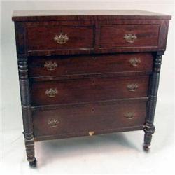 AN EMPIRE FIGURED MAHOGANY CHEST OF DRAWERS