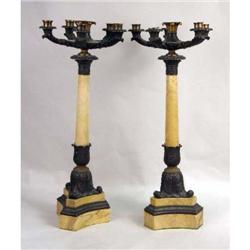 A PAIR OF GILT-BRONZE AND EBONIZED MARBLE CANDELABRA