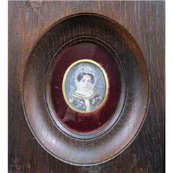 A FRAMED HANDPAINTED MINIATURE PORTRAIT OF A WOMAN
