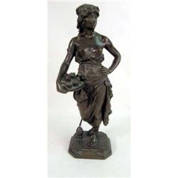 AN ORIENTALIST CAST-BRONZE SCULPTURE OF A YOUNG WOMAN BEARING A PLATTER OF FRUIT