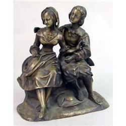 A MOVEABLE GILT-BRONZE SCULPTURE OF A WELL-DRESSED YOUNG COUPLE