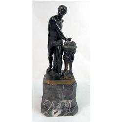 A CLASSICAL-STYLE CAST-BRONZE SCULPTURE OF A YOUNG ATHLETE OR WARRIOR OFFERING INCENSE ON A FIERY BR