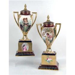 A PAIR OF HAND-PAINTED POLYCHROME PARCEL-GILT DECORATED COVERED HANDLED PORCELAIN PEDESTAL URNS