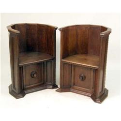 TWO CARVED OAK ECUMENICAL CHOIR-STALL SEATS
