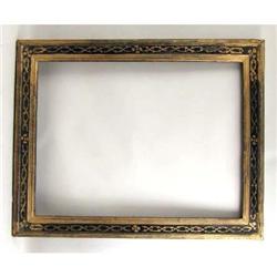 A CONTINENTAL PART-EBONIZED AND PARCEL GILT WOOD PICTURE FRAME