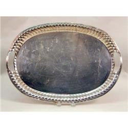 A OVAL MEXICAN STERLING SILVER FOOTED AND DOUBLE-HANDLED SERVING TRAY