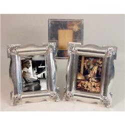 THREE LARGE SILVER-METAL FRAMES